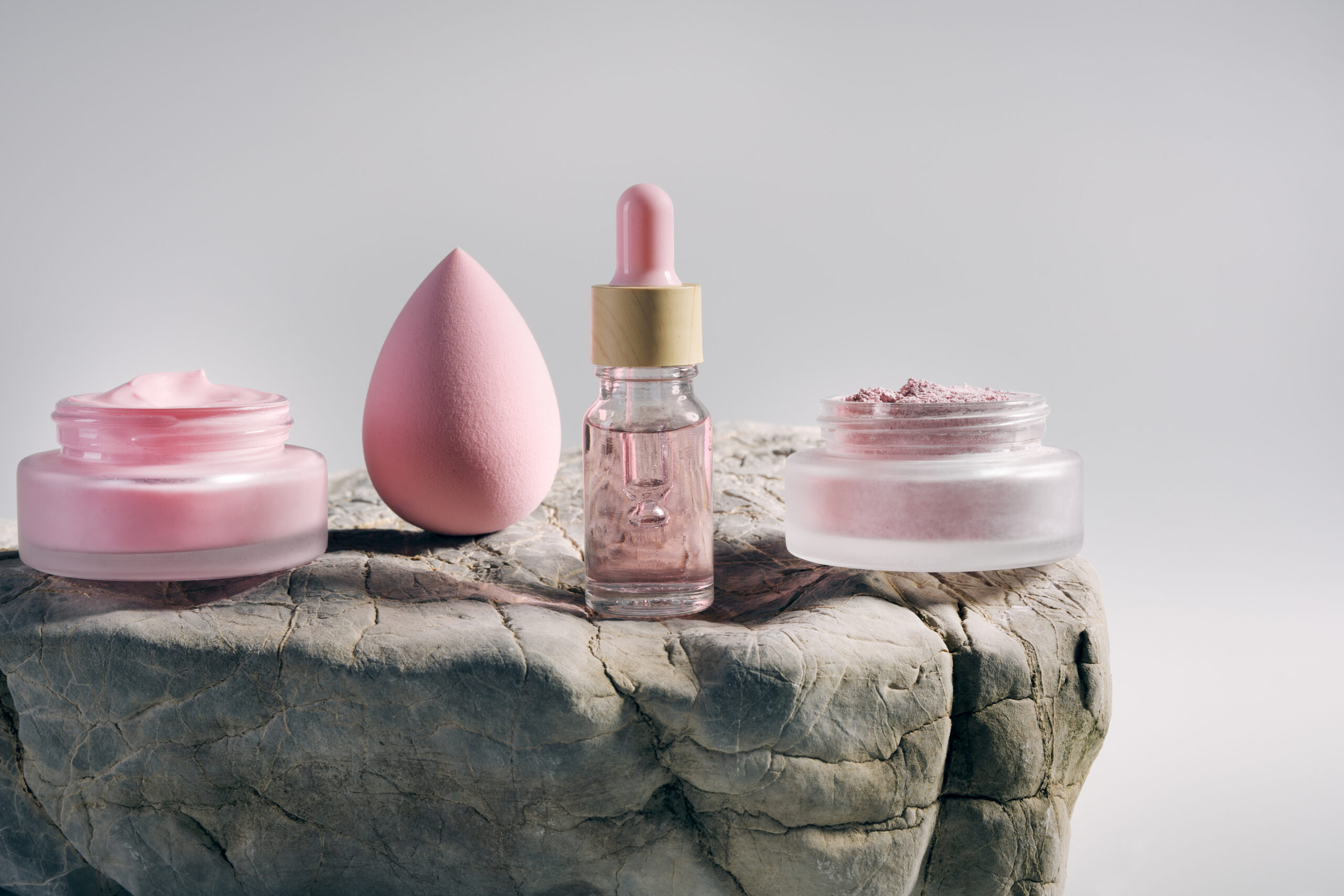 Cosmetic Products On A Big Rock